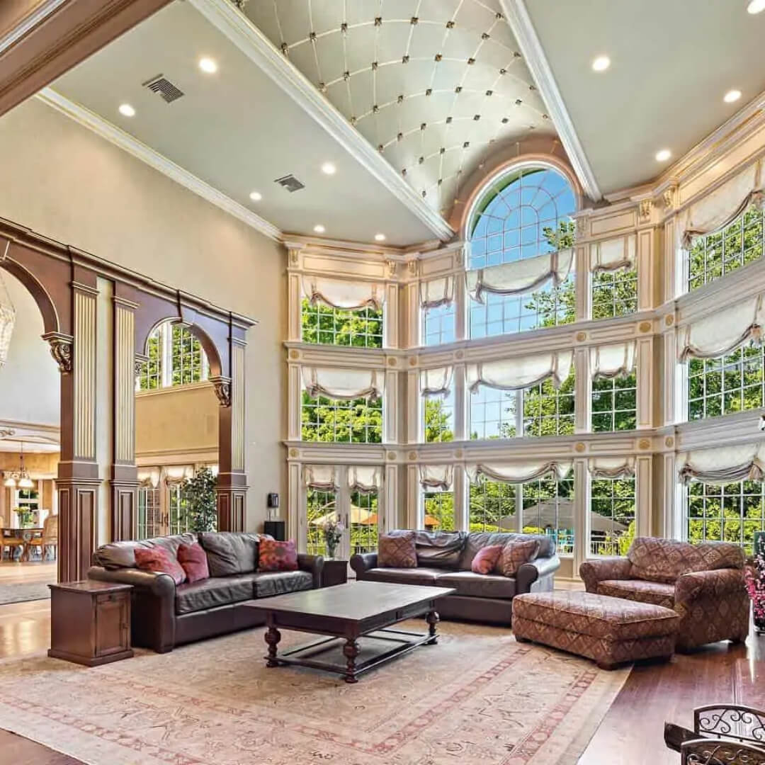 Luxurious living room with high ceiling and wooden archways